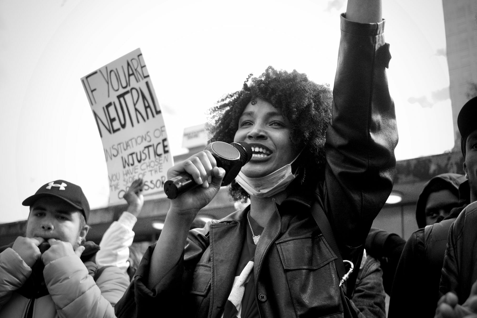 woman holding up sign at protest
