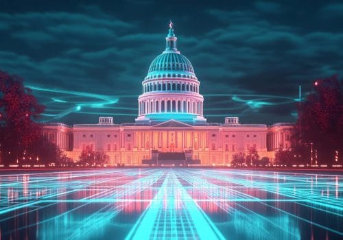 U.S. Capitol building illuminated in pink and blue at night, with glowing turquoise digital lines extending across the foreground and around the building